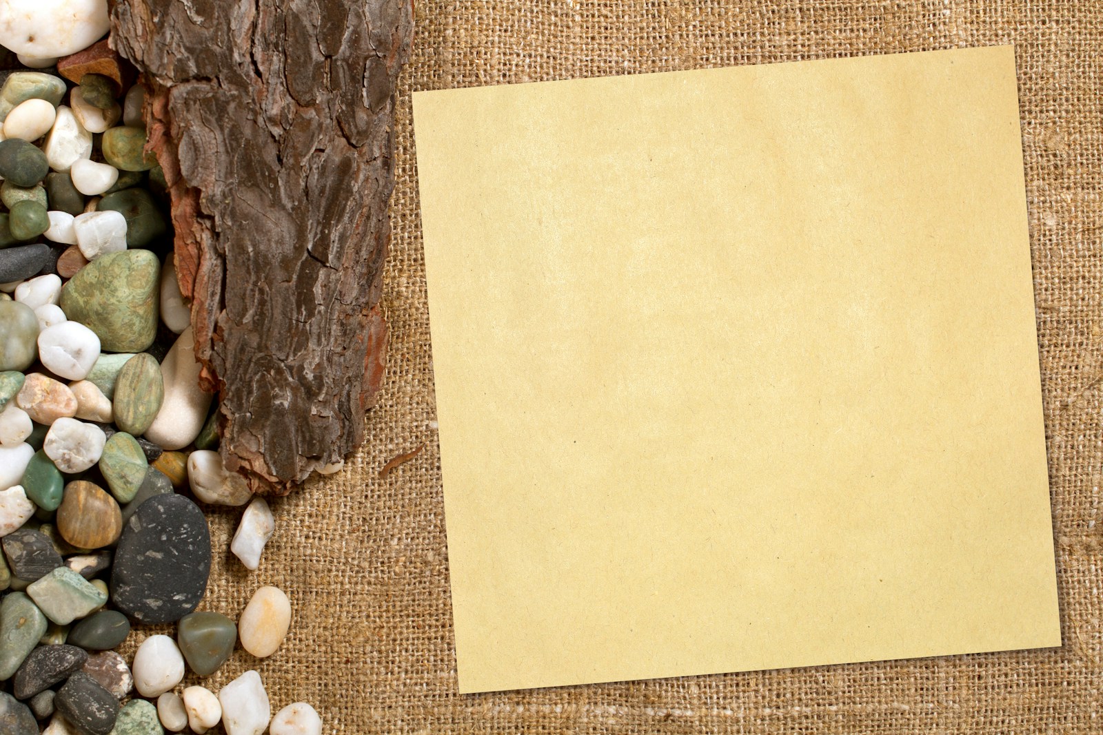 a piece of paper sitting on top of a pile of rocks